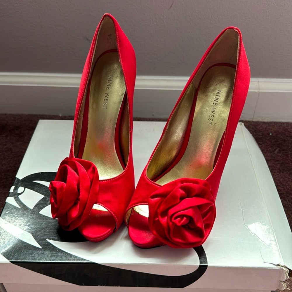 Red satin heels.